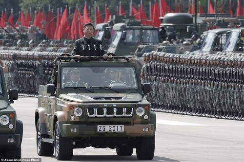870503-4653110-Chinese_President_Xi_Jinping_inspec
