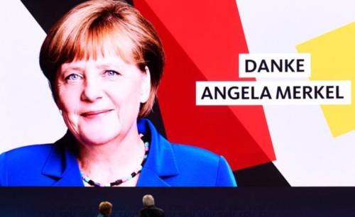 _104688568_merkeldankevidreut7dec.jpg
