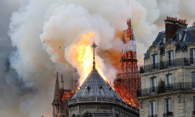 82228602_Smoke-and-flames-rise-during-a-fire-at-th